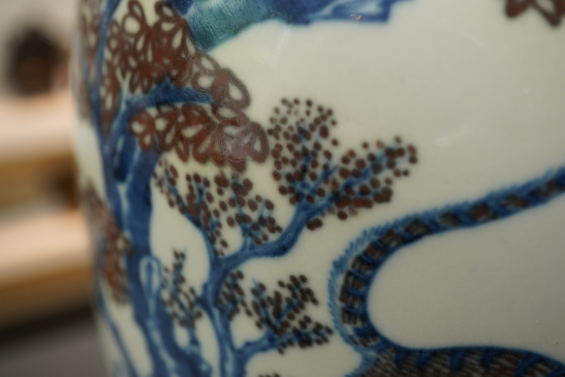 A Chinese underglaze blue and copper red ’dragon and tiger’ baluster vase, possibly 19th century